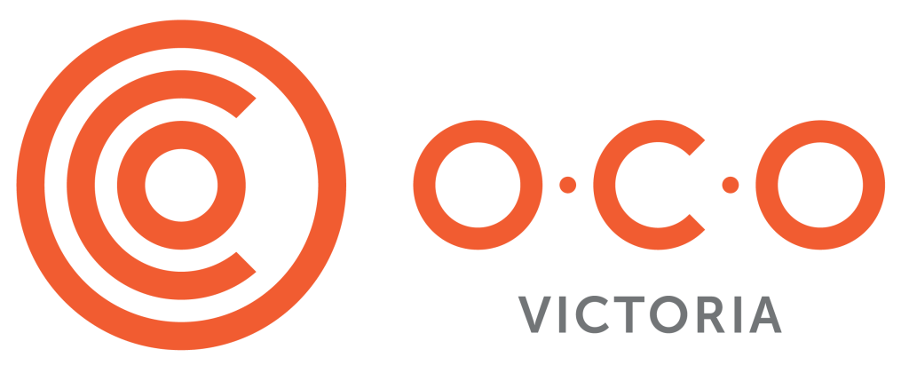 Logo of O.C.O. Victoria featuring a circular design with varying shades of orange and gray typography.